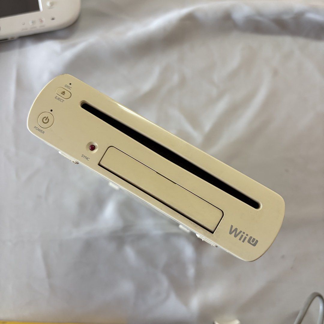 Nintendo Wii U Basic Pack 8GB [WUP-101 (JPN)] (Category: Nintendo) located in Taguig. Submitted by 2hand927483 (Listing ID 1439617568, Image 3). Description: Nintendo Wii U Basic Pack 8GB [WUP-101 (JPN)] - REGION LOCKED JAPANESE CONSOLE ISSUES: - Yellowing of rubber joycons in the gamepad. - Console has signs of usage (stains, yellowing, light scratches, and deep scratches) - Slight vignette on the gamepad. INCLUSIONS: - Nintendo Wii U Console [W