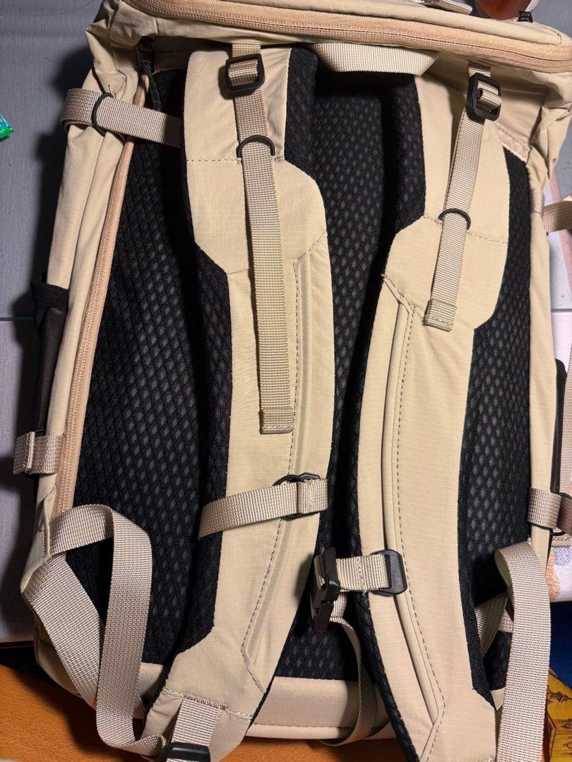 On Cloud Speed Pack 30L Backpack (Category: Backpacks) located in Makati City. Submitted by ellope (Listing ID 1439651504, Image 2). Description: On Cloud Speed Pack 30L backpack in beiges. Features multiple straps, compartments, and a mesh back panel for breathability. Includes internal pockets, top zipper closure, and adjustable straps. Speed Pack model label inside..