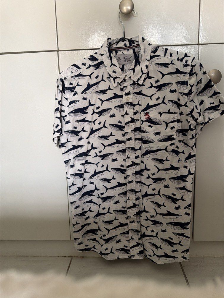 Original Penguin Short Sleeve Shirt (Category: Tshirts & Polo Shirts ) located in Quezon City. Submitted by yourprelovedhub (Listing ID 1439624847, Image 1). Description: - Original Penguin short sleeve shirt - White shirt with whale, shark, and crab pattern - Features the Original Penguin logo - Fits S-M.