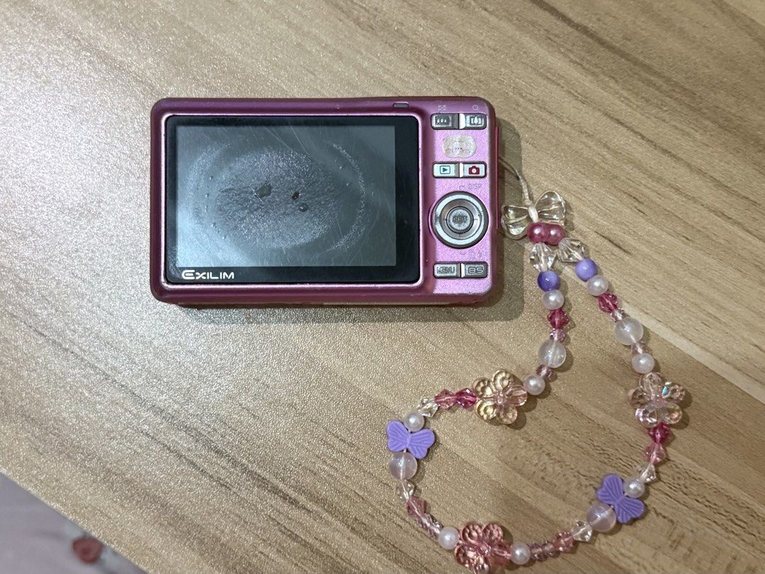 Pink Casio Exilim EX-Z9 🍀📸 (Category: Cameras) located in Manila. Submitted by xiaolongmallow (Listing ID 1439648045, Image 2). Description: 🔅 8.1 megapixels 🔅 built-in flash 🔅 pre-loved compact digicam ! issues: 🔅 only bottom button is working (flash settings button) (does not affect ability to take pictures) 🔅 lcd burn (does not affect output) 🔅 broken battery cover, but battery lock is still working (does not affect output) inclusions: