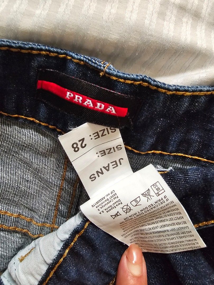 Prada Jeans Shorts Size 28 (Category: Luxury Apparel) located in Manila. Submitted by mhelcgm (Listing ID 1439802581, Image 2). Description: - Authentic Prada jeans shorts - Size 28 - Classic dark blue wash - Standard five-pocket design - Prada logo on back pocket and label - Contrasting yellow stitching.