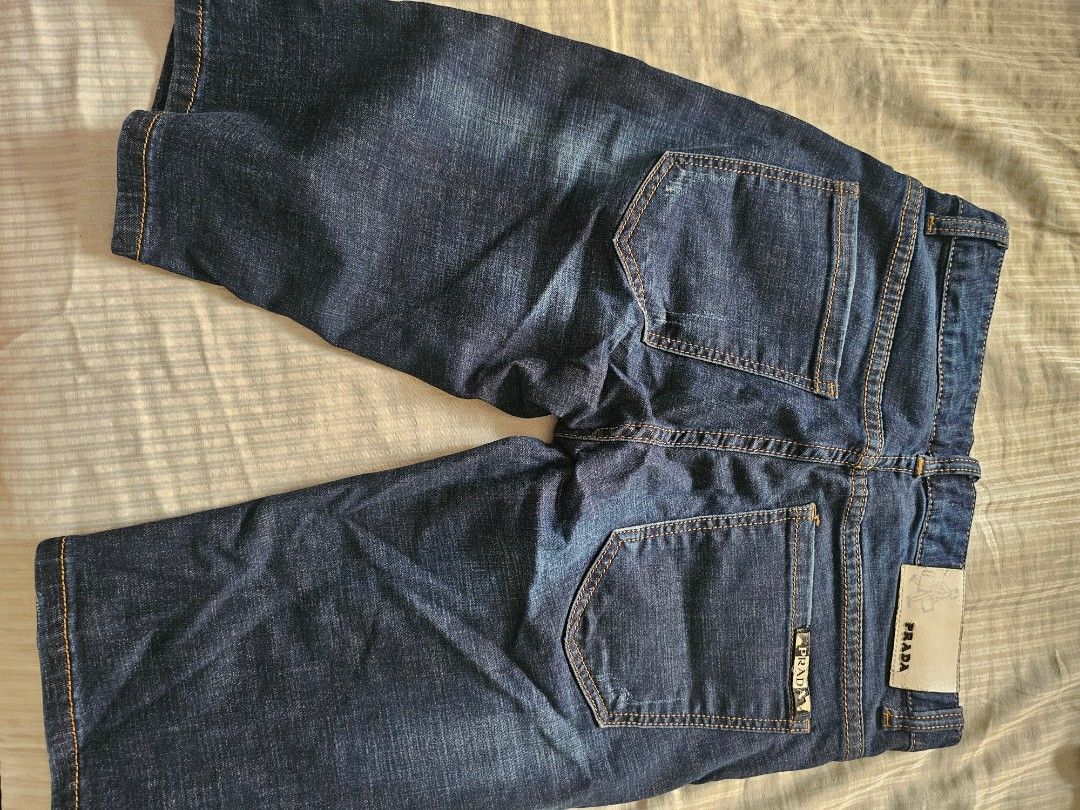 Prada Jeans Shorts Size 28 (Category: Luxury Apparel) located in Manila. Submitted by mhelcgm (Listing ID 1439802581, Image 3). Description: - Authentic Prada jeans shorts - Size 28 - Classic dark blue wash - Standard five-pocket design - Prada logo on back pocket and label - Contrasting yellow stitching.