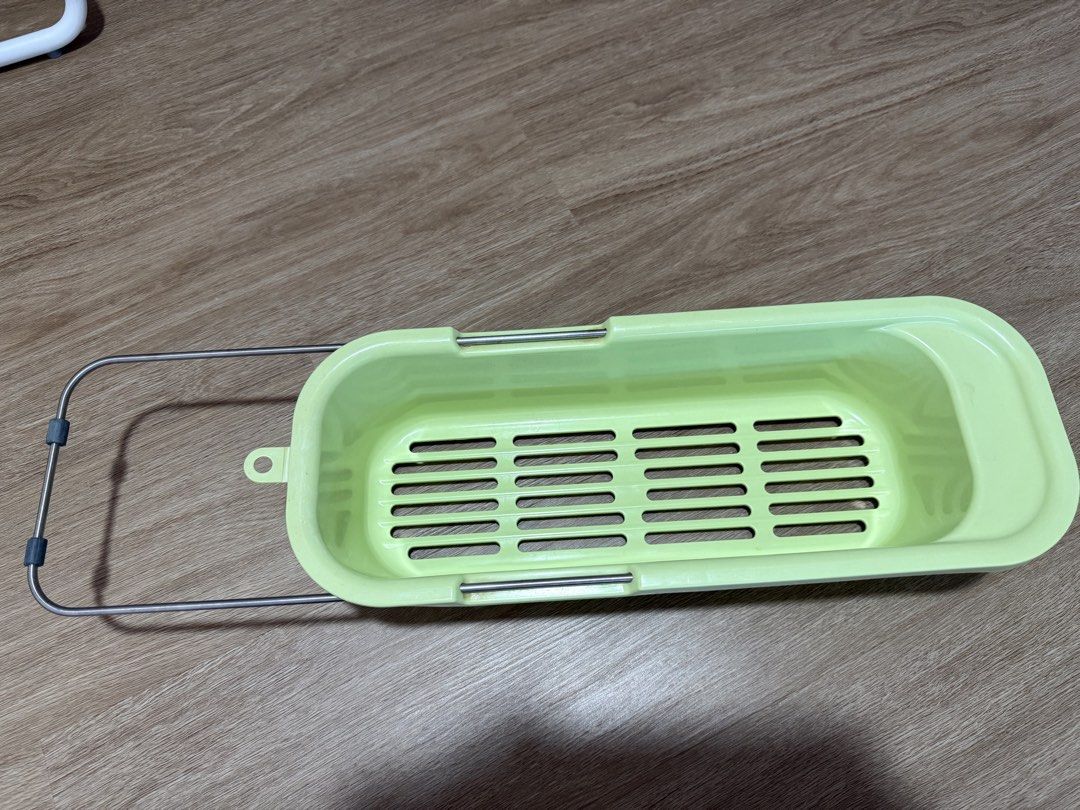 Rectangular Basket (Category: Storage Boxes & Baskets) located in Singapore. Submitted by ly_lo (Listing ID 1439627208, Image 1). Description: - Green rectangular basket - Features a handle - Made of plastic with a metal handle - Slotted base for drainage.