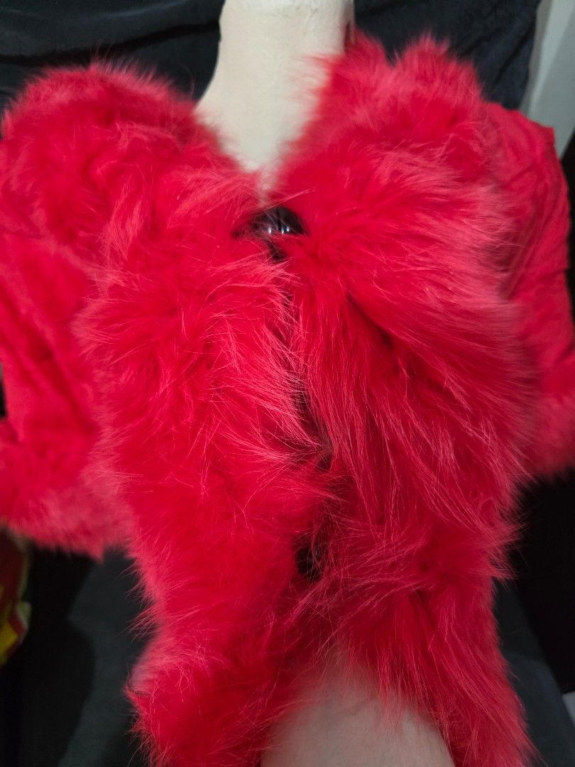 Red Faux Fur Shawl (Category: Coats, Jackets and Outerwear) located in Pasig City. Submitted by ecka.j (Listing ID 1439789158, Image 3). Description: Selling preloved fur shawl❄️ buyer will handle dry cleaning. - Luxurious red faux fur shawl - Soft and plush texture - Comfortable fit - Secure 2 clasp closure - Adds elegance and warmth - Great for special occasions or winter trips.