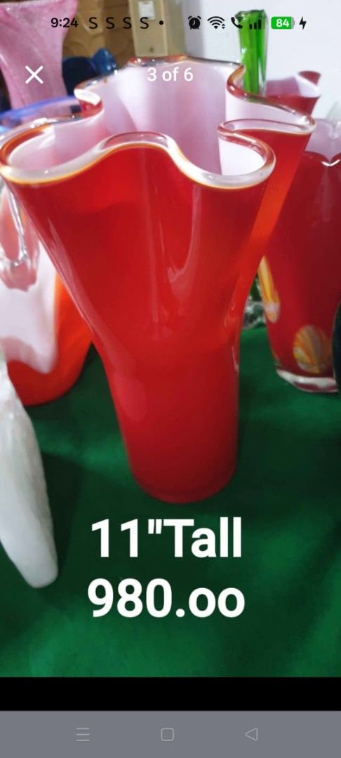 Red Glass Vase 11" Tall (Category: Vases & Decorative Bowls) located in Manila. Submitted by maryammen08029 (Listing ID 1439751016, Image 1). Description: - Elegant red glass vase - 11 inches tall - Unique wavy rim design - Adds a pop of color - Ideal for flowers or decoration.