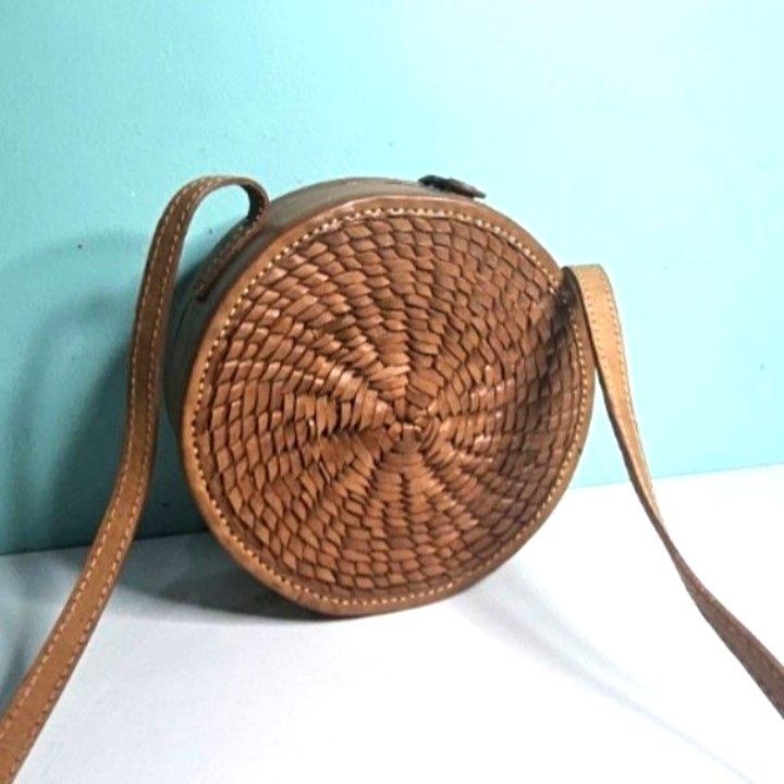 Round Woven Crossbody Bag Bali (Category: Cross-body Bags) located in Imus. Submitted by mostlyvintage (Listing ID 1439788079, Image 1). Description: 🎀 round woven crossbody bag from Bali, Indonesia 🎀 🎀 adjustable strap🎀 🎀 flap closure 🎀 🎀 brown fabric lining 🎀 🎀 a portion of the lining has come off on one side of the bag; it needs to be glued 🎀 🌸 for fashion finds and other stuff, pls. visit my other store: https://carousell.app.link/