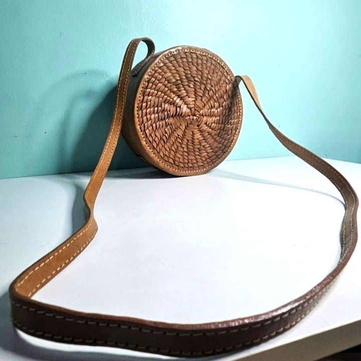 Round Woven Crossbody Bag Bali (Category: Cross-body Bags) located in Imus. Submitted by mostlyvintage (Listing ID 1439788079, Image 2). Description: 🎀 round woven crossbody bag from Bali, Indonesia 🎀 🎀 adjustable strap🎀 🎀 flap closure 🎀 🎀 brown fabric lining 🎀 🎀 a portion of the lining has come off on one side of the bag; it needs to be glued 🎀 🌸 for fashion finds and other stuff, pls. visit my other store: https://carousell.app.link/