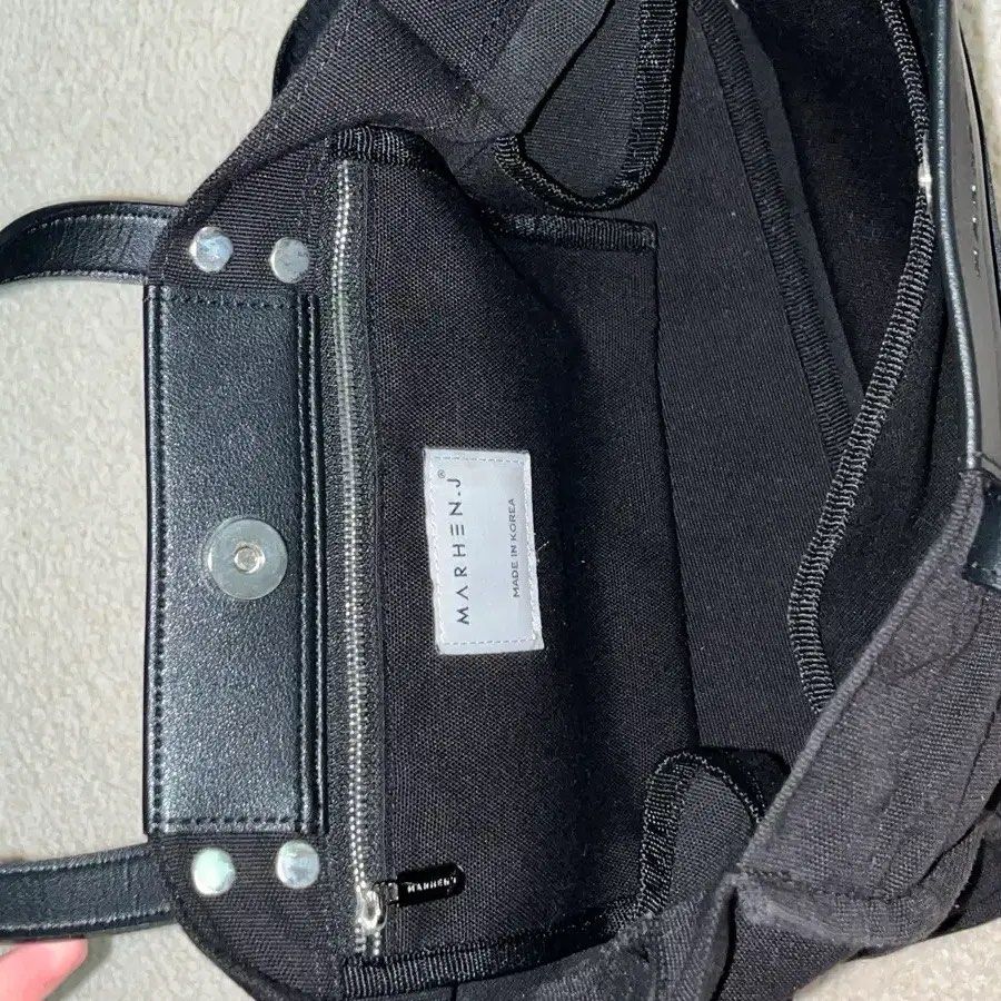 RUSH SALE! Authentic Marhen.J Kai Bag (Category: Shoulder Bags) located in Makati City. Submitted by goodvictory (Listing ID 1439745825, Image 3). Description: Marhen.J Kai Bag in black with a canvas and leather design.