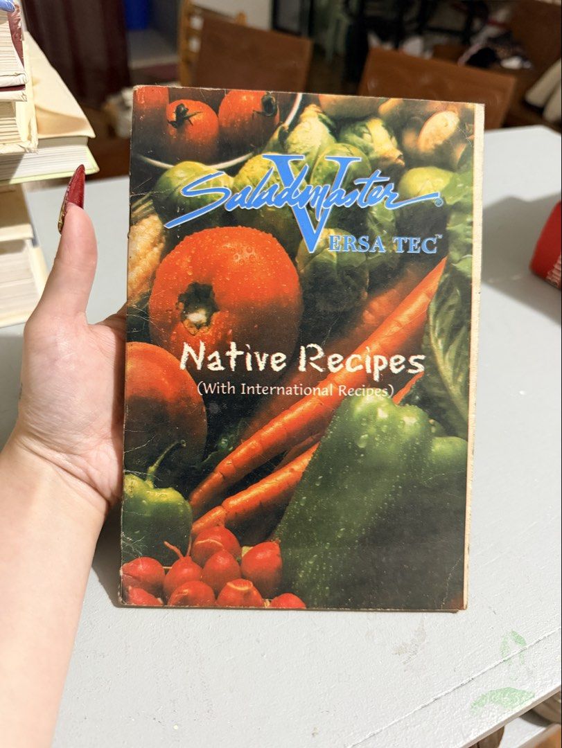 Saladmaster V Native Recipes Cookbook (Category: Storybooks) located in Baguio. Submitted by yse888 (Listing ID 1439796922, Image 1). Description: - Vintage cookbook - Features native and international recipes - Cover with vibrant vegetables - Includes Saladmaster V and ERSA TEC logos - Held in hand (size reference).