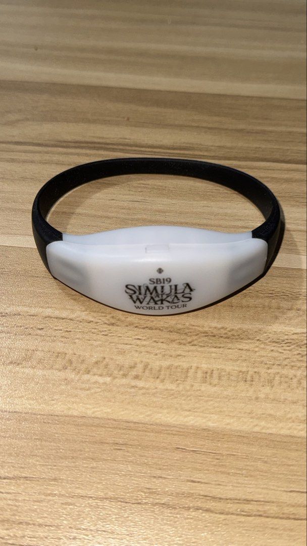SB19 Simula at Wakas LED Wristband (Category: Other Merchandise) located in Quezon City. Submitted by amillionsuns (Listing ID 1439791942, Image 1). Description: - Official SB19 Simula at Wakas World Tour wristband - Features a white central band - SB19 logo and tour name displayed - Black strap included - A must-have accessory for SB19 fans! .