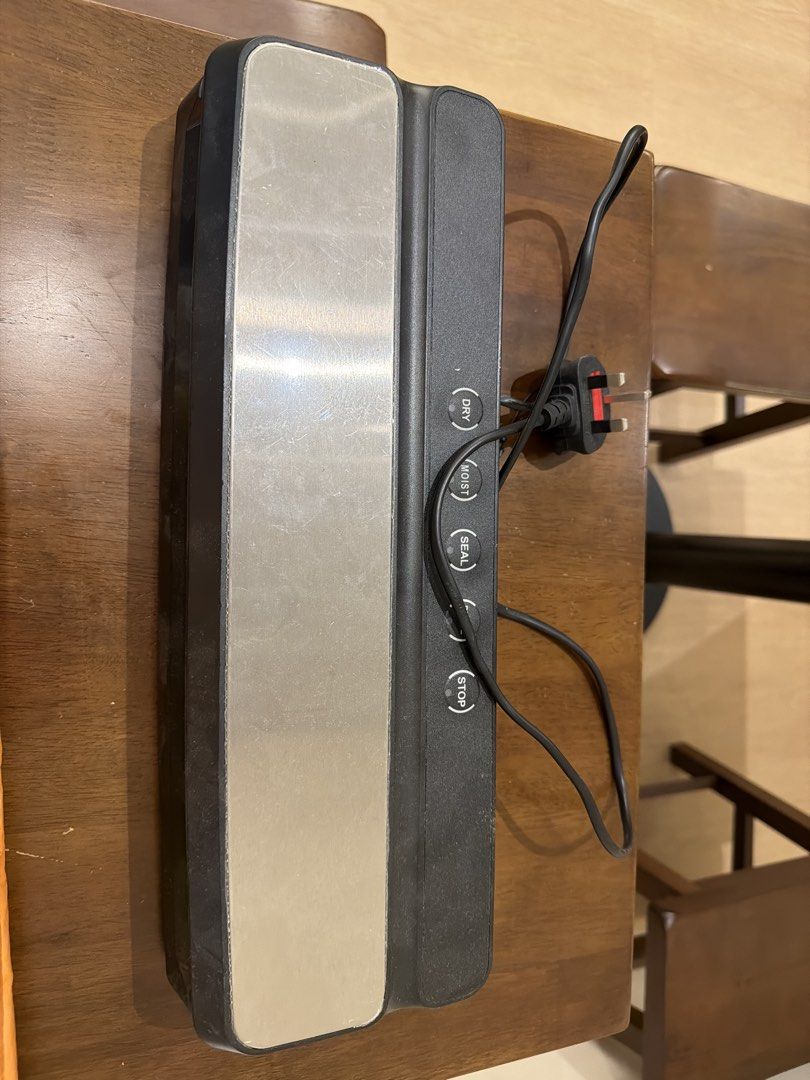 Sealing Machine (Category: Everything Else) located in Singapore. Submitted by regalstudio.sg (Listing ID 1439733989, Image 1). Description: - Features a sleek design. - Easy-to-use controls. - Perfect for home and commercial use. Comes with free plastic bags. Price negotiable..