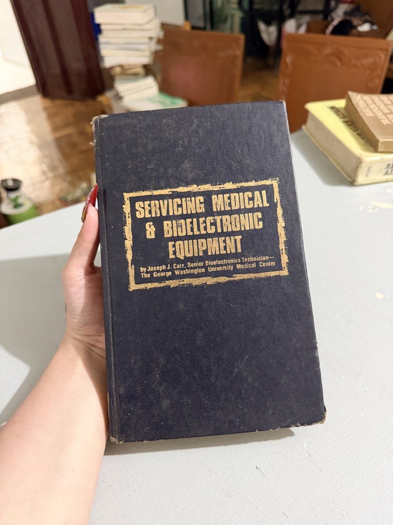 Servicing Medical & Bioelectronic Equipment Book (Category: Textbooks) located in Baguio. Submitted by yse888 (Listing ID 1439796568, Image 1). Description: - Title: Servicing Medical & Bioelectronic Equipment - Author: Joseph J. Carr - Publisher: The George Washington University Medical Center - Cover: Dark blue with gold lettering - Edition: Older edition.