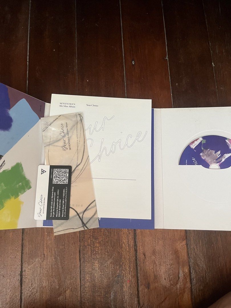 Seventeen 8th Mini Album Your Choice (Category: CDs & DVDs) located in Quezon City. Submitted by atashanini (Listing ID 1439698807, Image 2). Description: - Seventeen 8th Mini Album "Your Choice" - Includes album, CD, and inclusions - Features a colorful abstract album cover - CD is visible - Includes photocard and other items.
