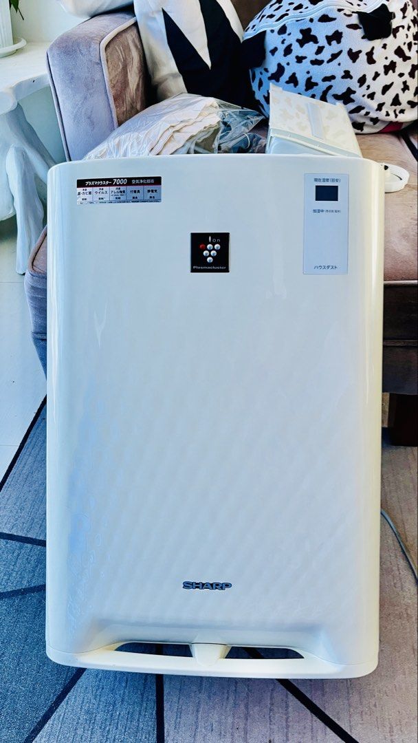 Sharp Air Purifier 7000 (Category: Air Purifiers & Dehumidifiers) located in Quezon City. Submitted by rongonzales02 (Listing ID 1439652091, Image 1). Description: - White Sharp air purifier - Top-mounted control buttons - Rear filter system - Equipped with wheels for mobility - Features the Sharp logo - Model number: 7000 Humidifying Air Purifier KC-Z45-W SHARP JET Rated voltage: 100-110V Rated frequency 50-60Hz Rated power consumption: 43W .
