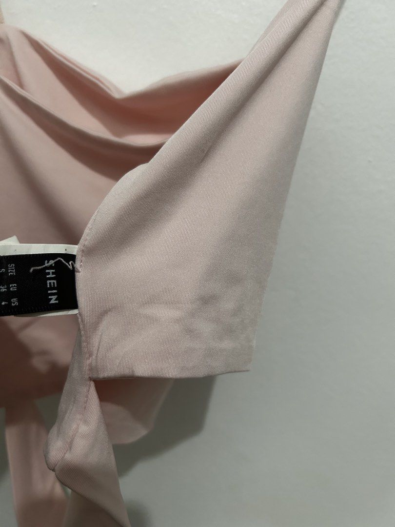 Shein Pink Crop Top (Category: Others Tops) located in Manila. Submitted by preloved_clothesmakati (Listing ID 1439626327, Image 2). Description: - Shein crop top - Soft pink color - Unworn condition - Unique design: thin straps and tie-back - Size tag included - Versatile for casual or dressed-up looks.