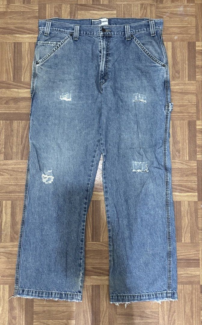 Signature Levi Strauss & Co. Carpenter Jeans (Category: Jeans) located in Manila. Submitted by eddy_ramos (Listing ID 1439685541, Image 1). Description: - Levi Strauss & Co. Carpenter Jeans - Light blue wash - Distressed details - Straight leg fit - Multiple pockets (including carpenter pocket) - Issue: holes.