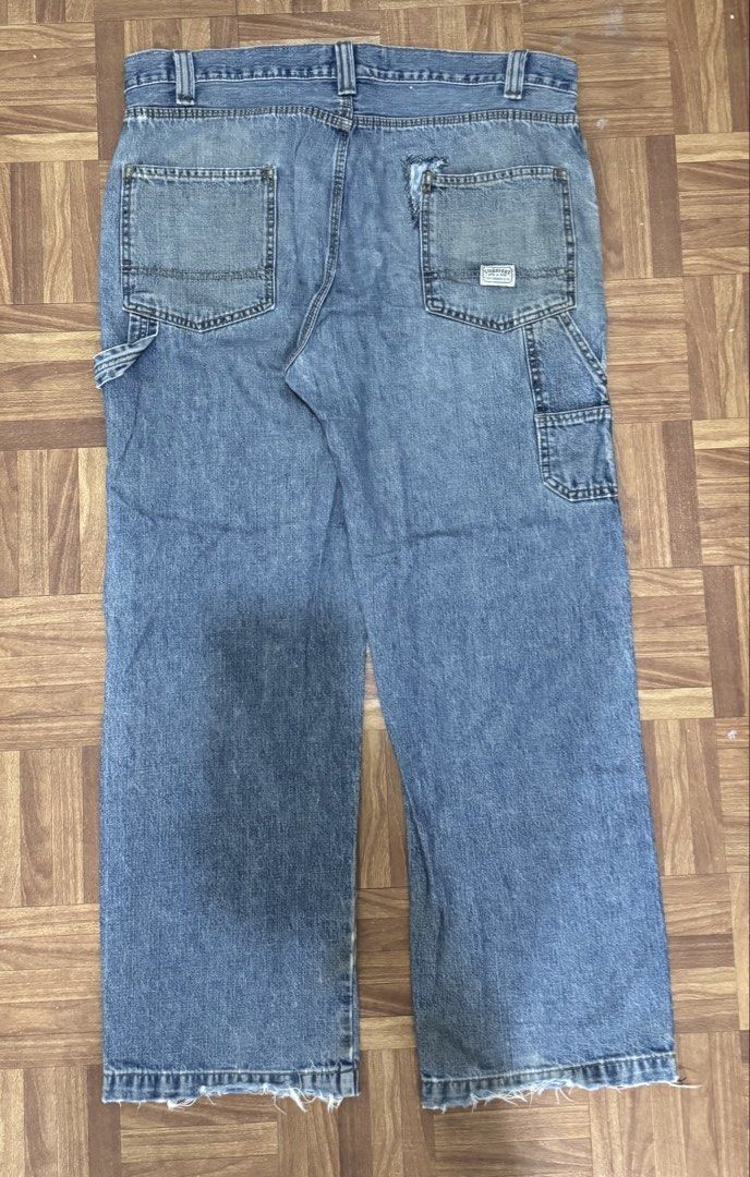 Signature Levi Strauss & Co. Carpenter Jeans (Category: Jeans) located in Manila. Submitted by eddy_ramos (Listing ID 1439685541, Image 2). Description: - Levi Strauss & Co. Carpenter Jeans - Light blue wash - Distressed details - Straight leg fit - Multiple pockets (including carpenter pocket) - Issue: holes.