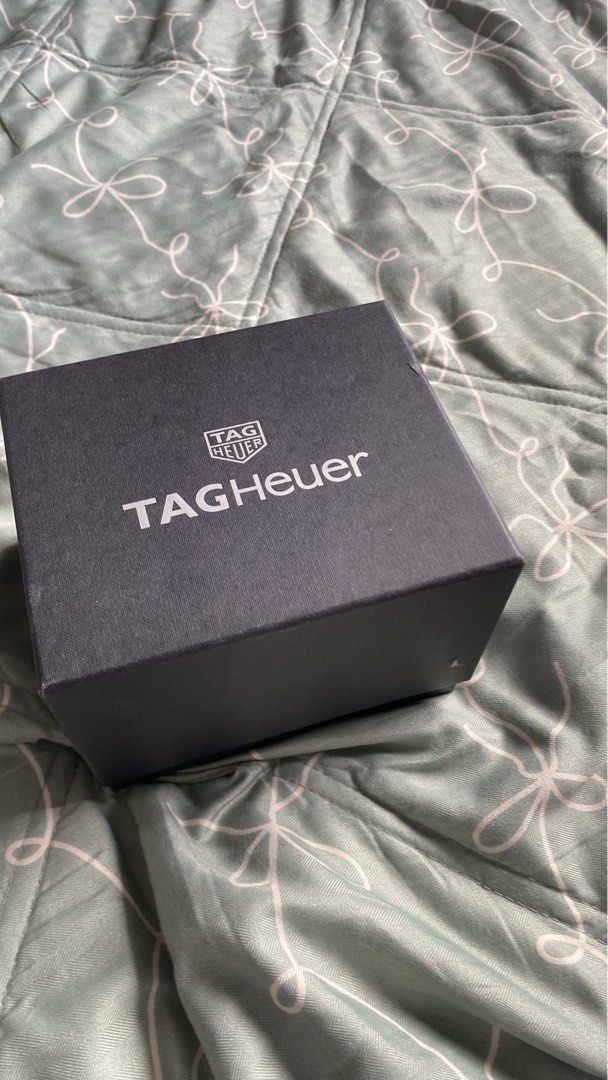 TAG Heuer Quartz Chronograph Watch (Category: Men's Watches) located in San Pedro. Submitted by jamaicanorange (Listing ID 1427216085, Image 3). Description: Tag Heuer Formula 1 Chrono Complete box, with free travel watch carrier Purchase at S$2000 RFS: decluttering, no battery NEGO!!! Listing includes the instructions and guarantee card for a TAG Heuer Quartz Chronograph watch. The card indicates the watch is covered against manufacturing defect