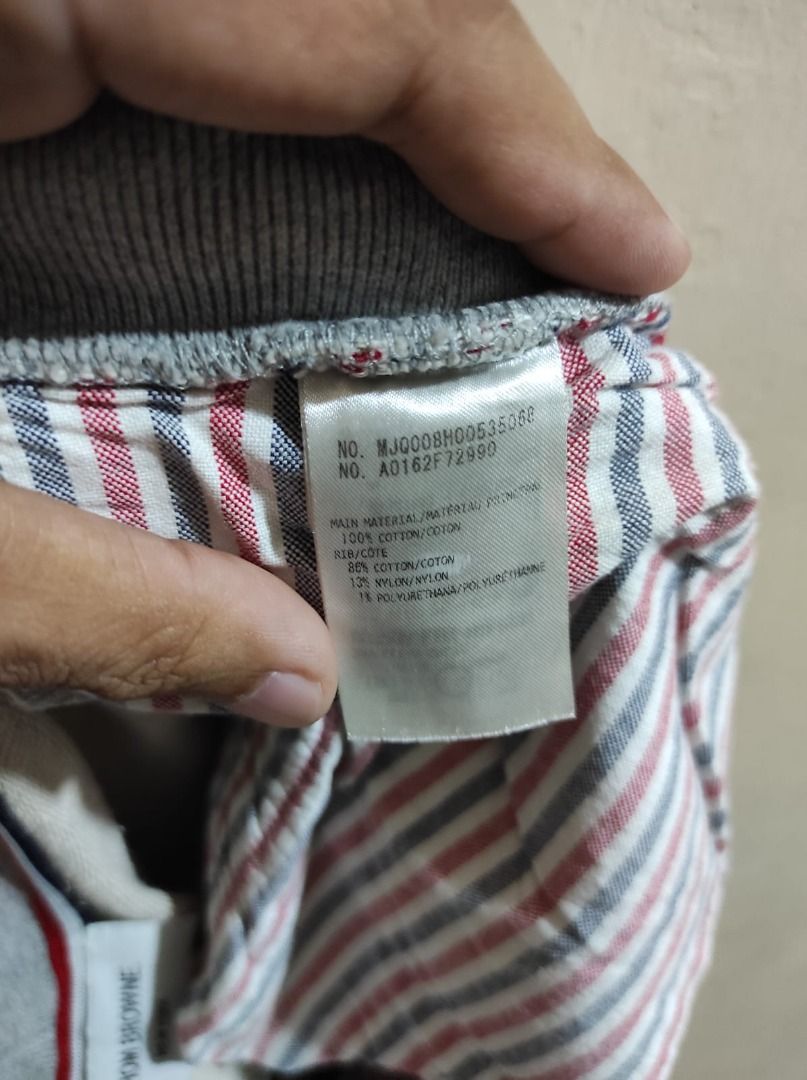 Thom Browne New York Sweat Shorts (Category: Luxury Apparel) located in Pasay City. Submitted by highkeys (Listing ID 1439718558, Image 3). Description: - Gray Thom Browne New York sweat shorts - Fits 32 to 34 - Signature white stripes on the side - Made in Japan - Drawstring waist - Pockets - Red, white, and blue striped interior lining - Material composition tag included.