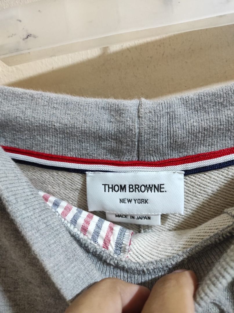 Thom Browne New York Sweat Shorts (Category: Luxury Apparel) located in Pasay City. Submitted by highkeys (Listing ID 1439718558, Image 2). Description: - Gray Thom Browne New York sweat shorts - Fits 32 to 34 - Signature white stripes on the side - Made in Japan - Drawstring waist - Pockets - Red, white, and blue striped interior lining - Material composition tag included.