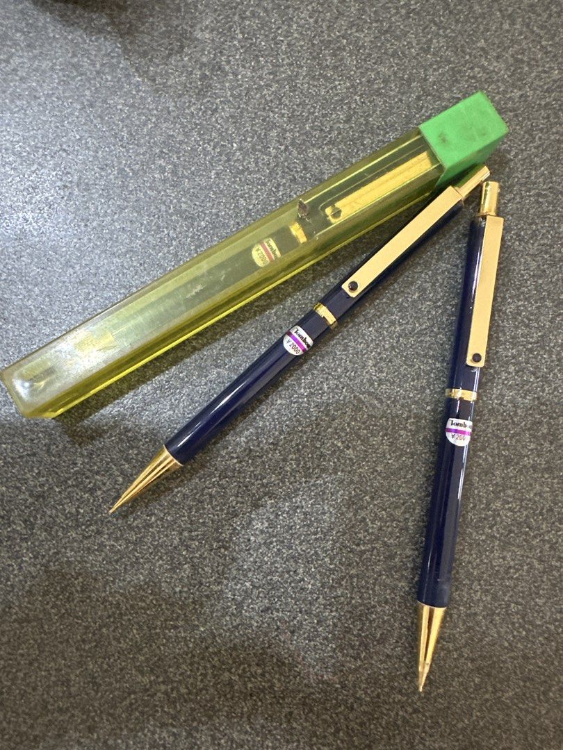 Tombow Mechanical Pencil (Category: Stationery & School Supplies) located in Cainta. Submitted by shopbyyna (Listing ID 1439621894, Image 1). Description: - Tombow Mechanical Pencil Set - Includes two navy blue pencils with gold accents - Also includes a green and yellow lead container - Price: ₱2000 As is take all.
