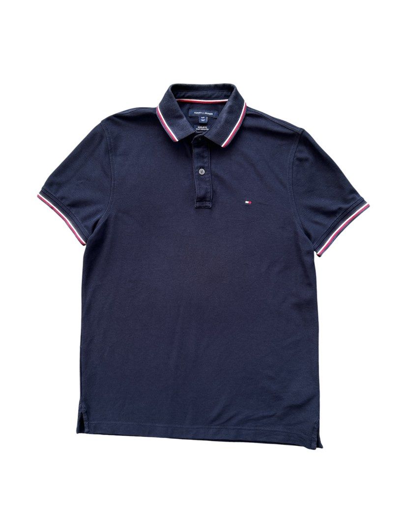 Tommy Hilfiger Polo Shirt (Category: Tshirts & Polo Shirts ) located in Angeles City. Submitted by outboxph (Listing ID 1439706136, Image 1). Description: CODE: NK34 TH Polo Shirt Dark Blue Colorway Authentic/Legit with tag and wash tag Size: Small on tag Dimensions: 26L x 19.5W Sleeve Length: 7.5L Condition: 8/10 discoloration sa collar 450 plus shipping fee.