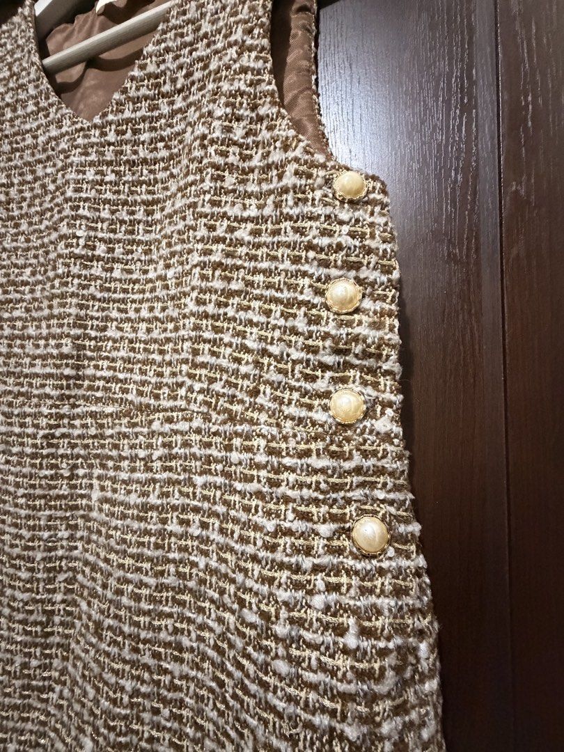 Tweed Dress with Pearl Buttons (Category: Dresses) located in Mandaluyong City. Submitted by giuseppina85 (Listing ID 1439765908, Image 2). Description: Brown and white tweed sleeveless dress. Features a V-neck, pearl buttons, and a light brown lining. A classic and versatile piece. Bust 34 inches Waist 28 inches.