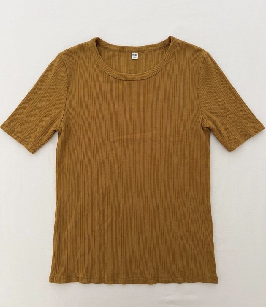 Uniqlo Ribbed Short Sleeve Top (Category: Shirts) located in Cabanatuan. Submitted by scrlttt (Listing ID 1439704804, Image 1). Description: - Uniqlo ribbed top - Round neckline - Short sleeves - Fitted silhouette - Warm, earthy color - Soft, comfortable material - Versatile for everyday wear.