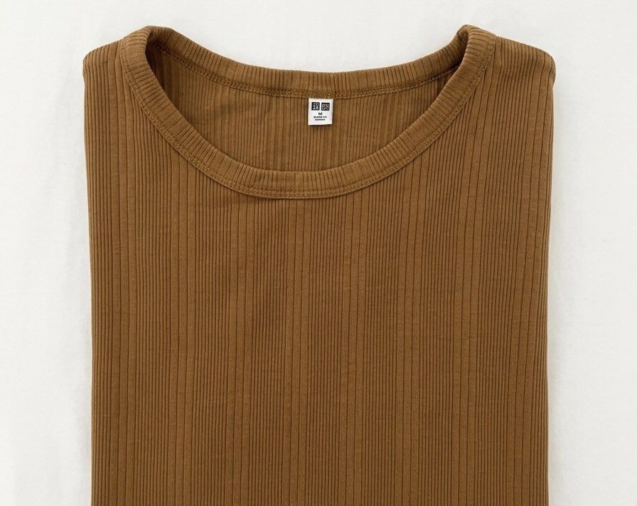 Uniqlo Ribbed Short Sleeve Top (Category: Shirts) located in Cabanatuan. Submitted by scrlttt (Listing ID 1439704804, Image 2). Description: - Uniqlo ribbed top - Round neckline - Short sleeves - Fitted silhouette - Warm, earthy color - Soft, comfortable material - Versatile for everyday wear.