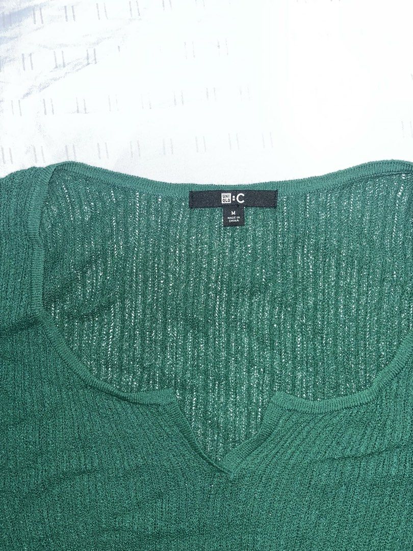 ST32 Uniqlo U-C Green Ribbed Top (Category: Shirts) located in Marikina City. Submitted by namicorner (Listing ID 1439634623, Image 2). Description: - Uniqlo U-C green ribbed top - Size: Medium - Features a scoop neckline with v-shaped detail - Short sleeves - Textured knit fabric .