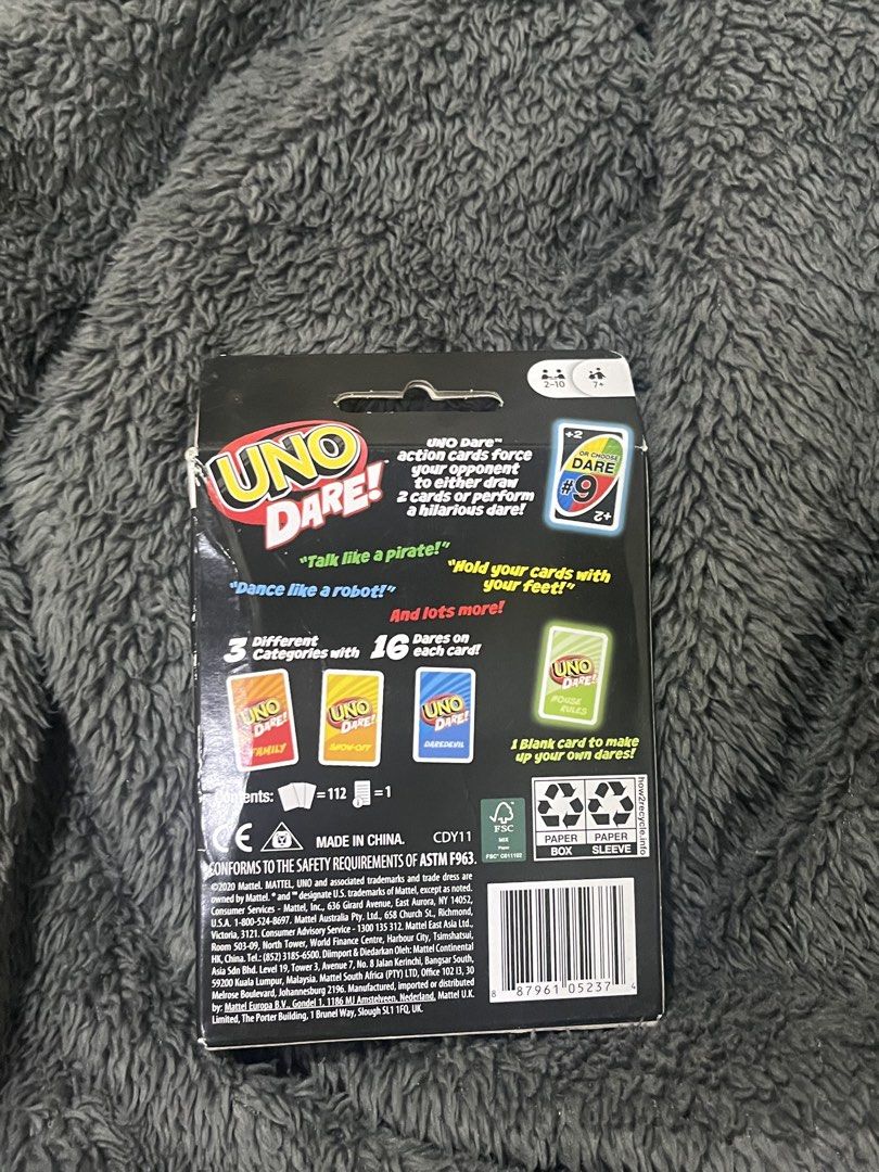Uno Dare Card Game (Category: Board Games & Puzzles) located in Manila. Submitted by ocellus (Listing ID 1439625850, Image 2). Description: - Uno Dare! card game - Includes action cards with draw-two or dare options - Features 3 dare categories with 16 dares each - Contains 112 cards - For 2-10 players - Get ready for a fun game night!.