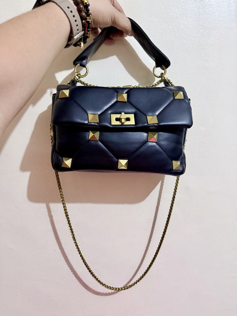 Valentino Garavani Studded Two-Way Bag (Category: Luxury Bags & Wallets) located in Cavite. Submitted by lady_speculator_ph (Listing ID 1439683779, Image 1). Description: - Japan sourced from my personal SA, not ukay - Black color - Handbag with original metal sling, can be used as a shoulder bag - Gold-tone hardware and studded details - Chain strap and top handle - Valentino Garavani label inside - Coded - Signs of use: Minor exterior wear and 