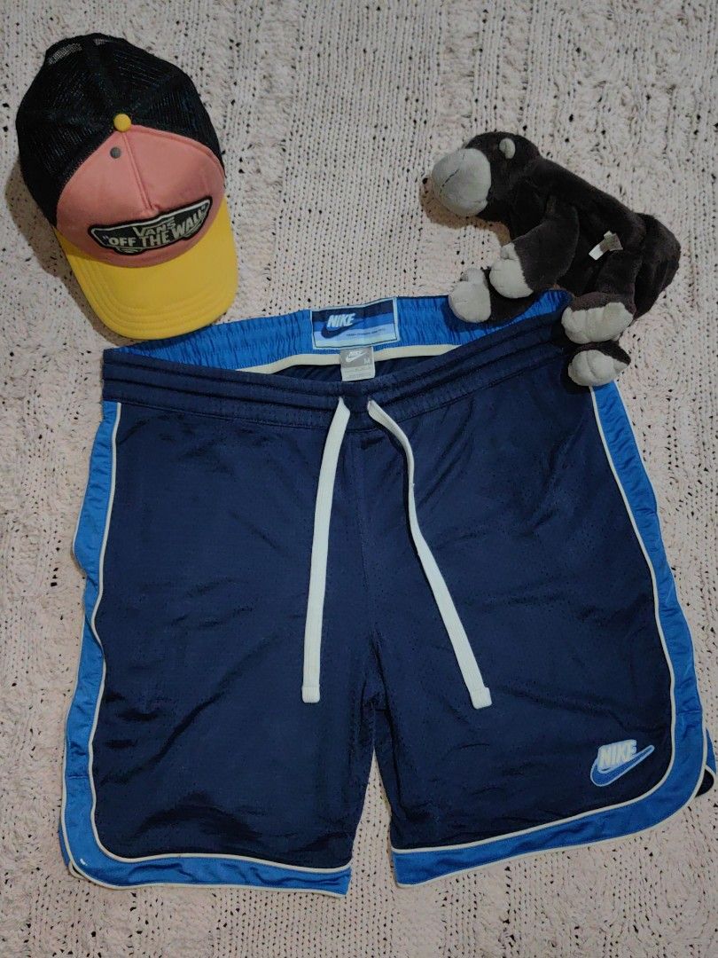 Vintage Nike Blue Active Training Shorts Men (Category: Shorts) located in Tuguegarao City. Submitted by ekko_bag (Listing ID 1439708098, Image 1). Description: Item Specifics: Condition - In very good condition. Thrifted from US Bale ✔️✔✔ - Jersey Shorts - Polyester Nylon - Large Drawstrings, Nike patch logo - Silver Tag, Blue Label - Stretched out elastic waistband - No pinhole, signs of usage,need wash ✔️✔✔ Dimension in inches L x W - 20 x 20 