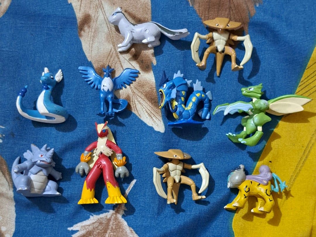 Vintage Pokemon Figures - Tomy (Category: Figurines & Statues) located in San Fernando, Camarines Sur. Submitted by ladderaya (Listing ID 1439687823, Image 1). Description: - Vintage Pokemon figure collection! - Features characters like Gyarados, Charizard, and more. - Manufactured by Tomy in China. - Includes Nintendo markings for authenticity. - Ideal for Pokemon collectors..