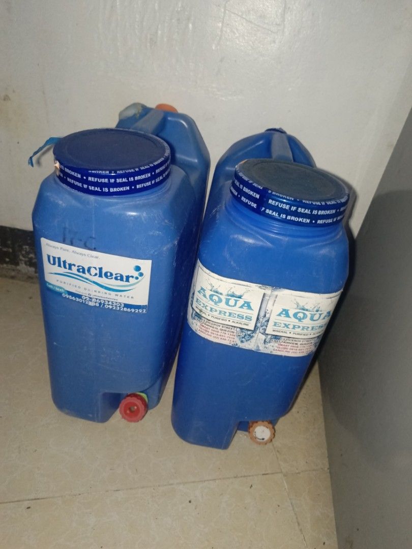 Water Gallons (Category: Water Bottles & Tumblers) located in Quezon City. Submitted by eyesellgoodthings (Listing ID 1439708152, Image 1). Description: - Two water containers included - Brands: Aqua Express and UltraClear - Blue screw-on lids - Equipped with spigots for easy dispensing - Made of durable plastic - Suitable for home and outdoor use - Ideal for water storage - No Holes .