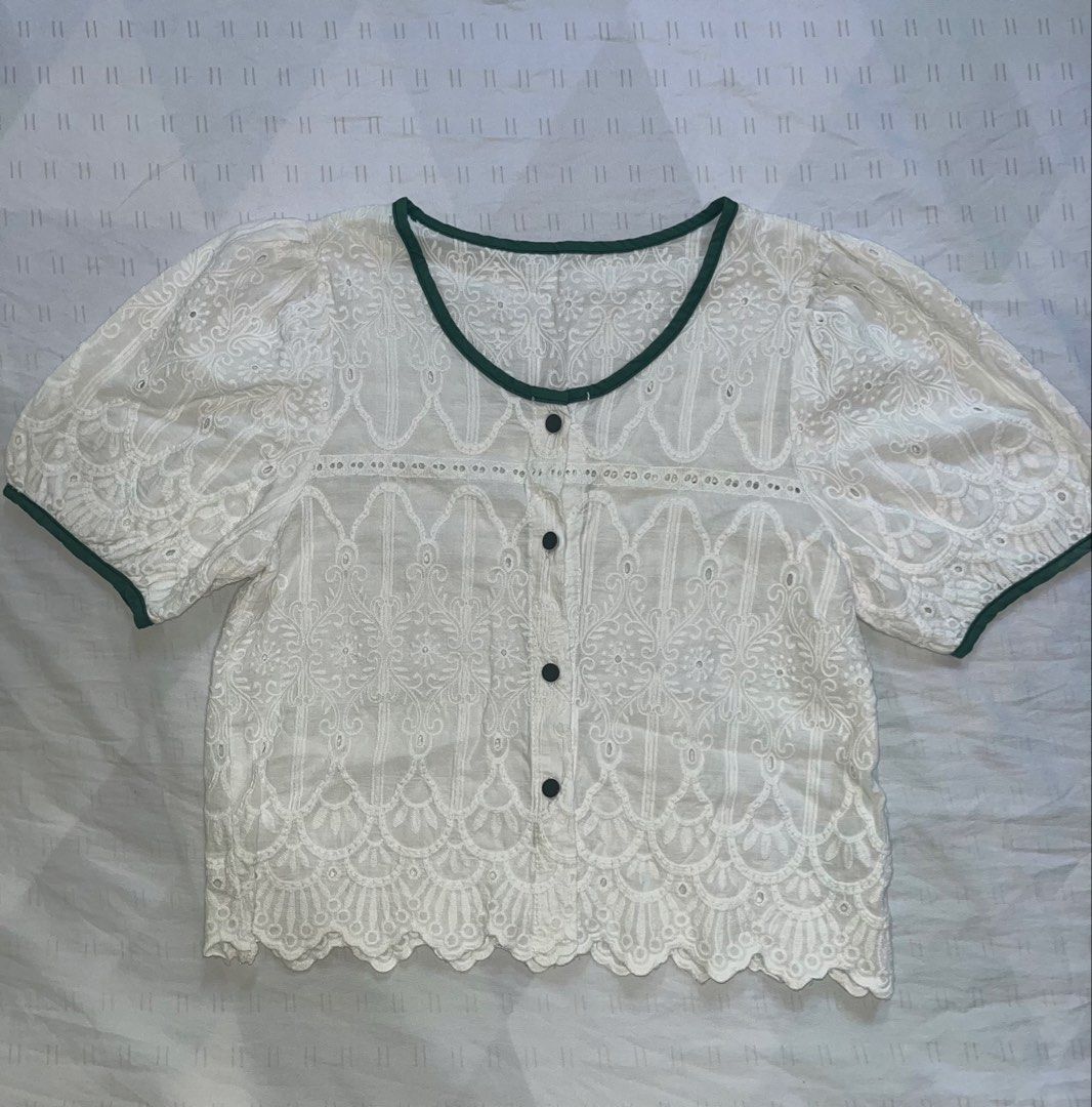 ST33 White Embroidered Blouse with Green Trim (Category: Blouses) located in Marikina City. Submitted by namicorner (Listing ID 1439634408, Image 1). Description: - White blouse with delicate embroidery - Features a scalloped hem - Short, puffy sleeves - Round neckline with green trim - Button-down front - Lightweight fabric, ideal for warm weather - Versatile style: dress it up or down.