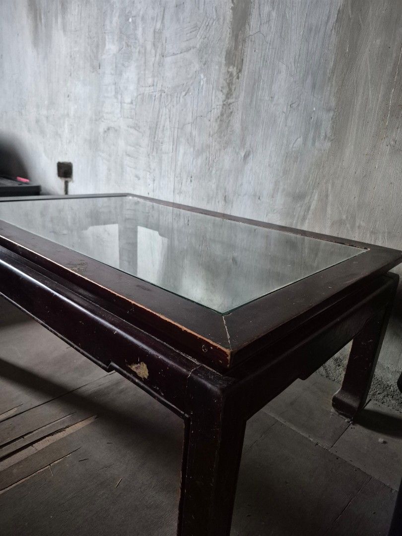Wooden Coffee Table with Glass Top (Category: Tables & Sets) located in Bacoor. Submitted by Talsp (Listing ID 1439742997, Image 3). Description: Made from Narra tree. It is heavy and need 2 people to carry it. - Dark wooden frame - Clear glass top - Rectangular shape - Sturdy base - Classic design - Ideal for living room use - Well-constructed.