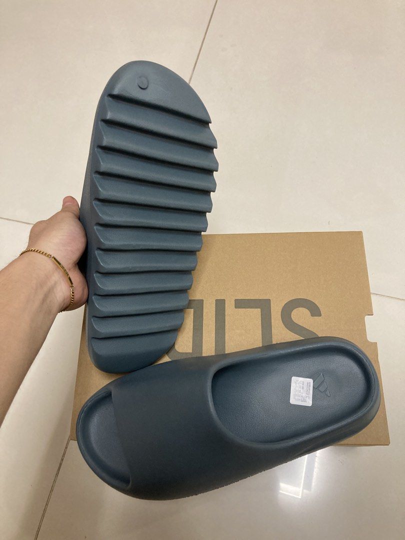 Yeezy slides (Category: Flipflops and Slides) located in Singapore. Submitted by sneakyjuicy (Listing ID 1439781877, Image 3). Description: Brand new yeezy slides slate marine Us10 Unworn Selling cheap because its now my size Brought it in vietname.