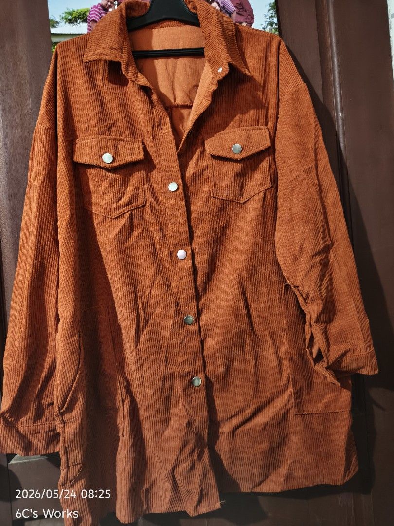 Yoins Corduroy Overshirt - XL (Category: Coats, Jackets and Outerwear) located in Consolacion. Submitted by mencytte (Listing ID 1439610816, Image 2). Description: Oversized corduroy shirt from Yoins. Features a button-down front, two chest pockets, and two side pockets. The shirt is a warm orange color. Size XL. Perfect for layering or wearing as a light jacket. The tag is still attached. each can be sold 150each or get all for 350pesos orange c