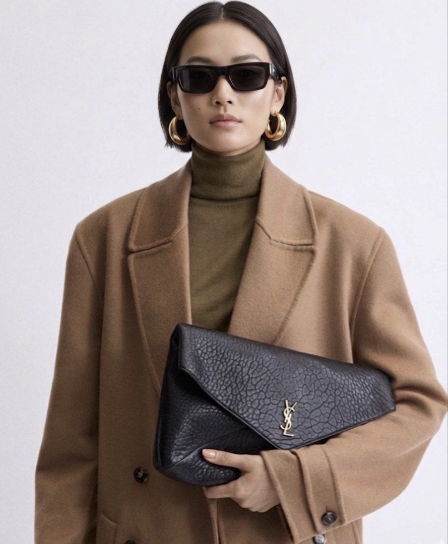 ⚜️YSL cassandre Pouch wallet on chain bag (Category: Luxury Bags & Wallets) located in Makati City. Submitted by 90sangel (Listing ID 1439668569, Image 1). Description: •Item: YSL pouch wallet 🖤 in supple lambskin •Size: X Large chain pouch •Condition: Brand New *Feautures stowable cable chain strap. Can be worn on the shoulder or held as a clutch! 🖤〰️ *Includes original dustbag, cards and big paperbag. — Additional fee for YSL box .