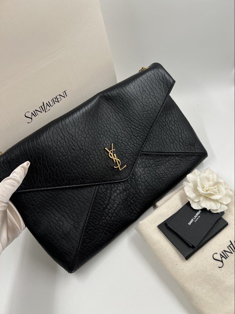⚜️YSL cassandre Pouch wallet on chain bag (Category: Luxury Bags & Wallets) located in Makati City. Submitted by 90sangel (Listing ID 1439668569, Image 3). Description: •Item: YSL pouch wallet 🖤 in supple lambskin •Size: X Large chain pouch •Condition: Brand New *Feautures stowable cable chain strap. Can be worn on the shoulder or held as a clutch! 🖤〰️ *Includes original dustbag, cards and big paperbag. — Additional fee for YSL box .