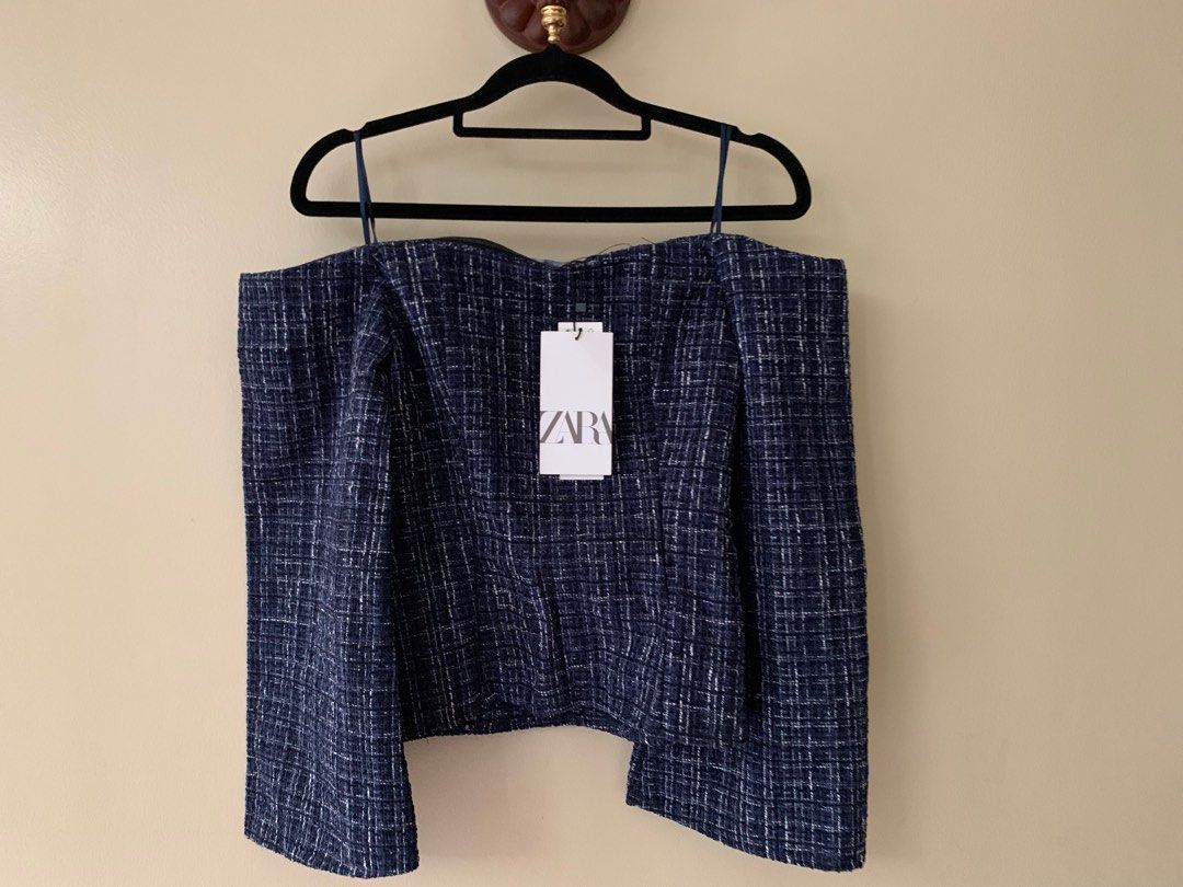 Zara Tweed Off-shoulder top (Brand New) (Category: Blouses) located in Marikina City. Submitted by projectsparkjoy (Listing ID 1439676259, Image 1). Description: Zara Off-Shoulder (Brand New with tag) Size: XS Color: Navy Blue with off white and black Material: Tweed ✨Has a silicone anti-slip on the chest and shoulder area to prevent from slipping down. ✨Side-zipper ✨Bell-shaped 3/4 sleeves.