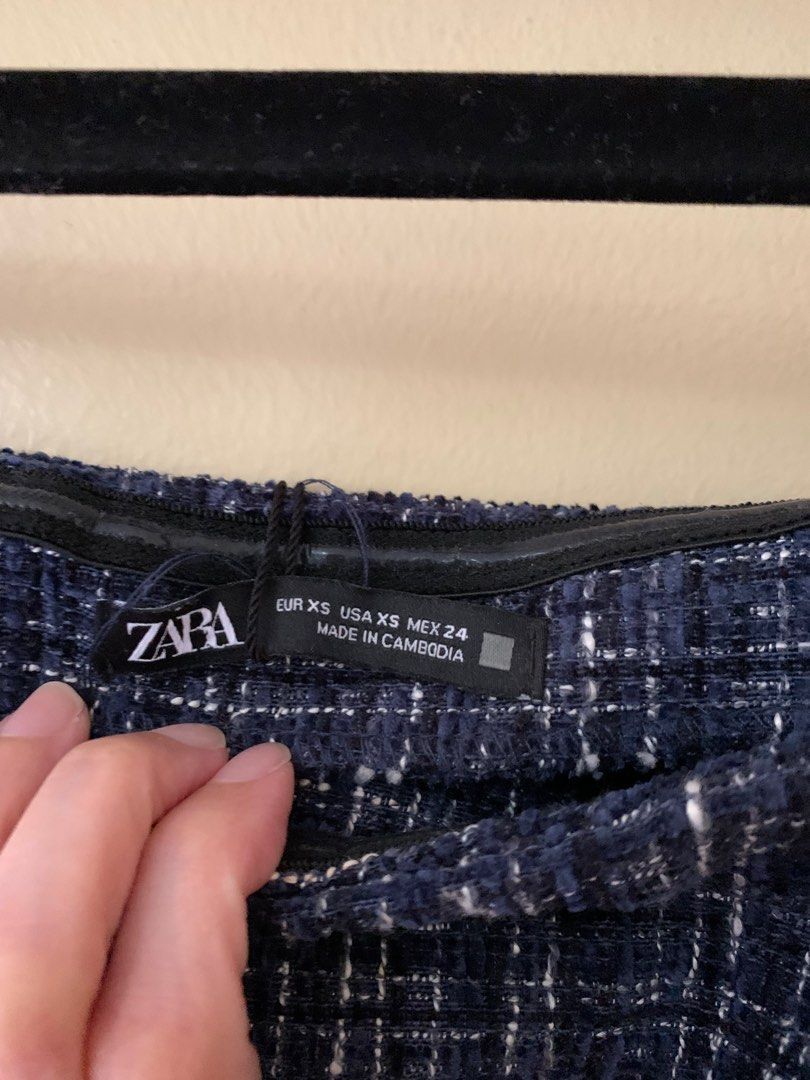 Zara Tweed Off-shoulder top (Brand New) (Category: Blouses) located in Marikina City. Submitted by projectsparkjoy (Listing ID 1439676259, Image 3). Description: Zara Off-Shoulder (Brand New with tag) Size: XS Color: Navy Blue with off white and black Material: Tweed ✨Has a silicone anti-slip on the chest and shoulder area to prevent from slipping down. ✨Side-zipper ✨Bell-shaped 3/4 sleeves.