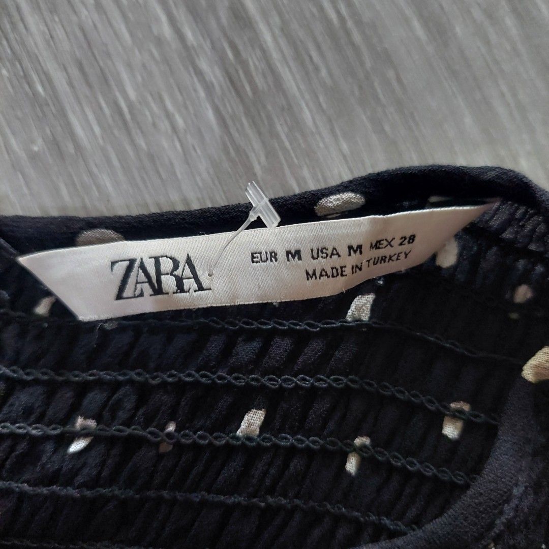 Zara Polka Dot Blouse - Size M (Category: Blouses) located in Governor Generoso. Submitted by cma_rarefitph (Listing ID 1439613796, Image 1). Description: - Zara black blouse with white polka dots - Size: M - Features: Long sleeves, shirred bodice, round neckline, flared hem - Material: Lightweight - Made in Turkey.