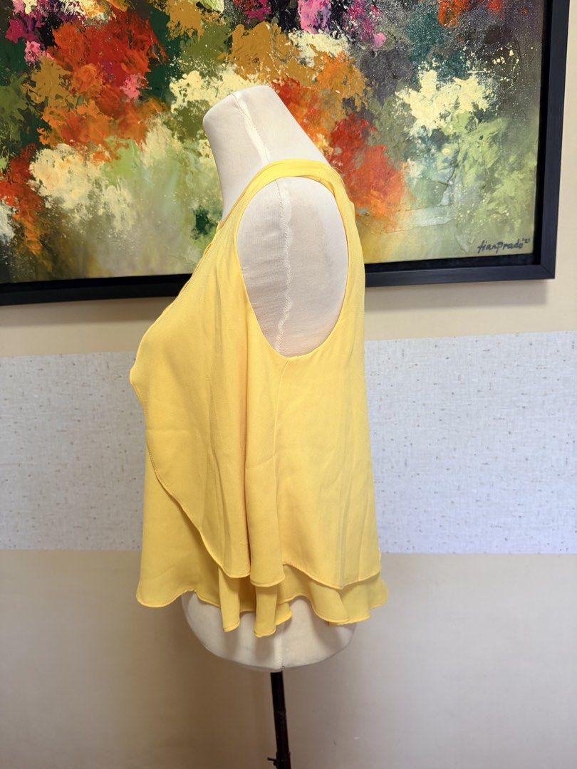ZARA sleeveless blouse (Category: Sleeveless) located in Muntinlupa City. Submitted by gap0710 (Listing ID 1439622041, Image 2). Description: Zara sleeveless yellow blouse. Perfect for office and casual wear. In excellent condition. .