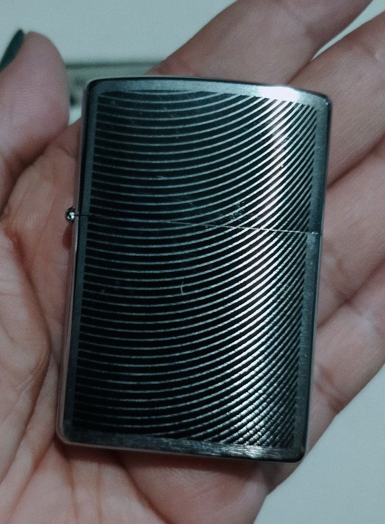 Zippo Lighter - Curve (29913) (Category: Vintage Collectibles) located in Caloocan City. Submitted by jessygeronimo (Listing ID 1439764701, Image 2). Description: - Authentic Zippo lighter - Made in the USA - Unique curved design - Silver finish with wave pattern - Includes original box.