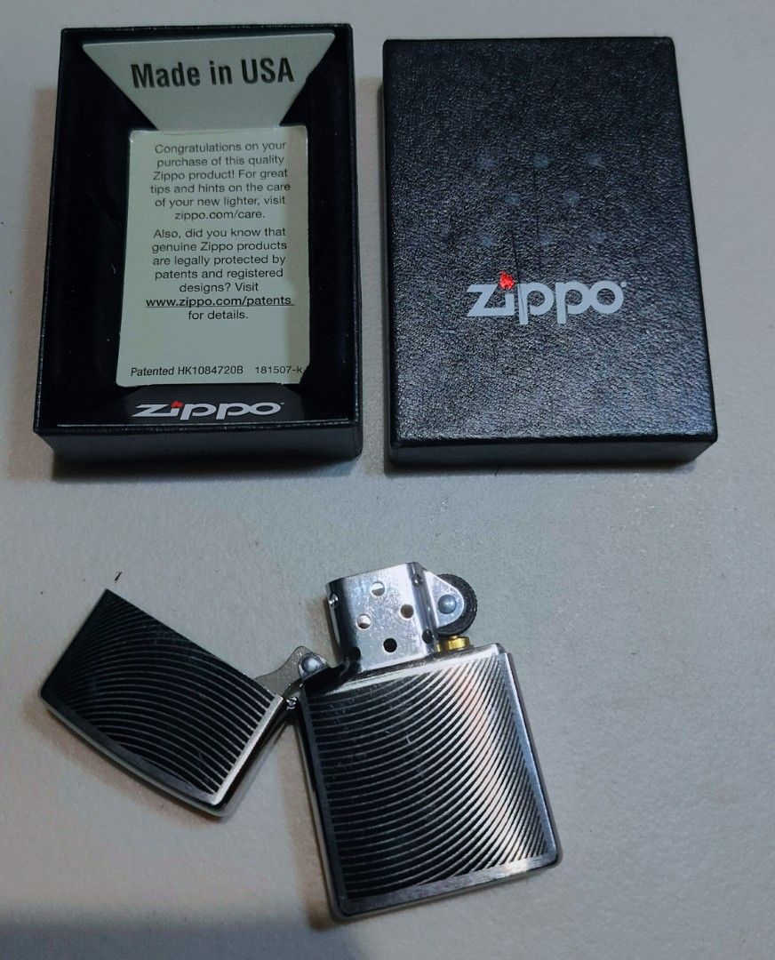 Zippo Lighter - Curve (29913) (Category: Vintage Collectibles) located in Caloocan City. Submitted by jessygeronimo (Listing ID 1439764701, Image 1). Description: - Authentic Zippo lighter - Made in the USA - Unique curved design - Silver finish with wave pattern - Includes original box.