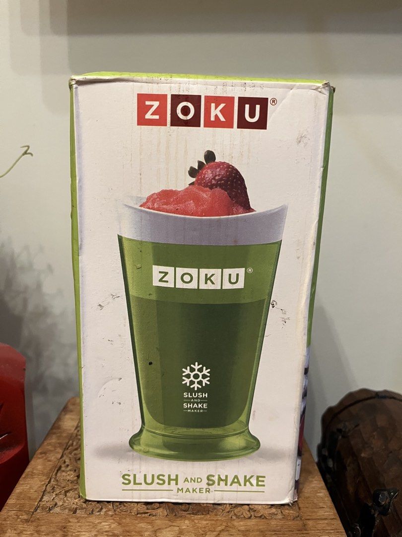 Zoku Slush and Shake Maker (Category: Juicers, Blenders & Grinders) located in Quezon City. Submitted by metamerchant (Listing ID 1439749503, Image 1). Description: - Zoku Slush and Shake Maker for homemade slushies and shakes. - Includes the original packaging. - Comes with a green cup and white lid. - Includes a stirring spoon. - Makes refreshing treats in minutes! - Box features a strawberry slushie..