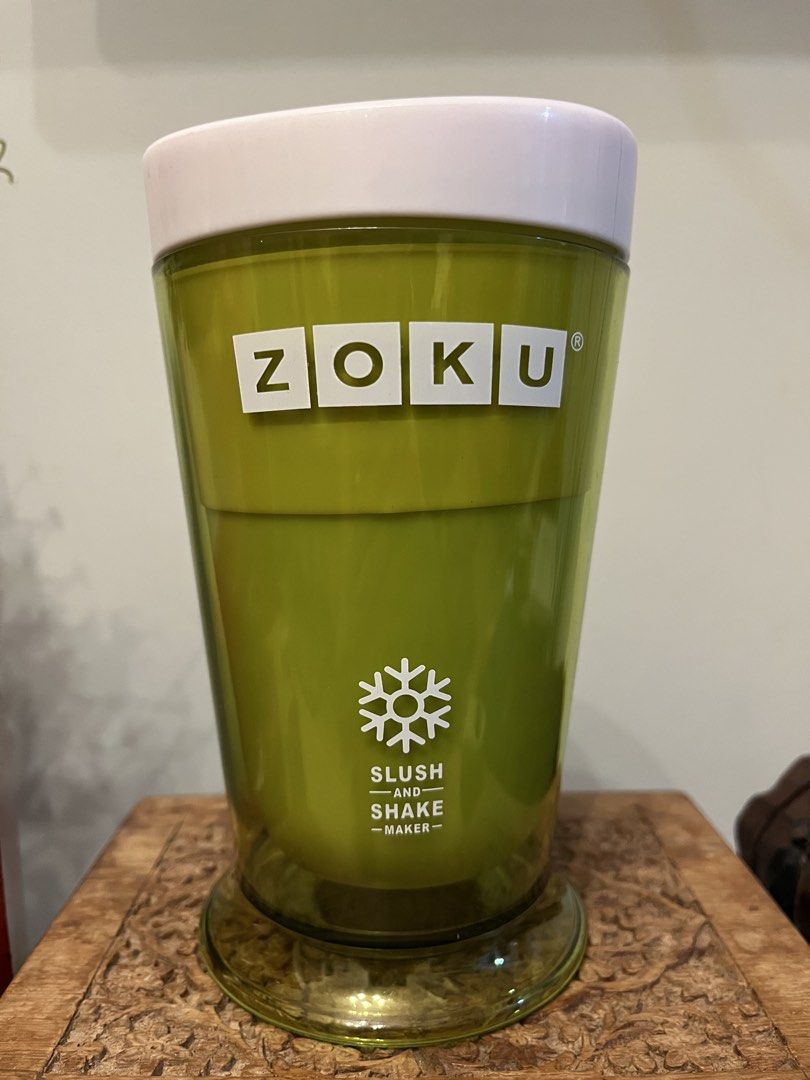 Zoku Slush and Shake Maker (Category: Juicers, Blenders & Grinders) located in Quezon City. Submitted by metamerchant (Listing ID 1439749503, Image 3). Description: - Zoku Slush and Shake Maker for homemade slushies and shakes. - Includes the original packaging. - Comes with a green cup and white lid. - Includes a stirring spoon. - Makes refreshing treats in minutes! - Box features a strawberry slushie..