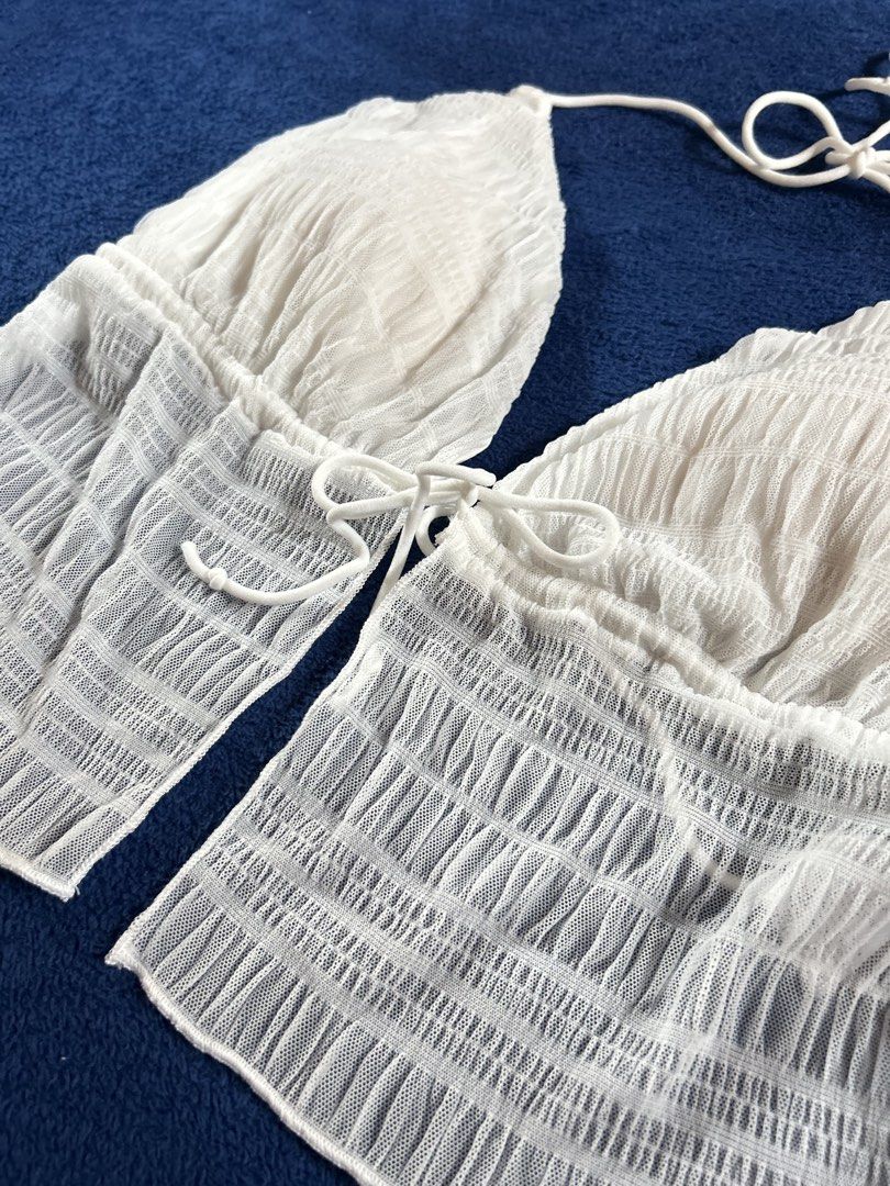 3XL WHITE CRINKLE MESH HALTER TOP (Category: Sleeveless) located in Manila. Submitted by declutter_lala (Listing ID 1439950034, Image 3). Description: !!!PLEASE READ!!! White Crinkle Mesh Ruffle Halter Top ✨ Crinkle mesh overlay fabric ✨ Triangle NOT PADDED bust area with halter adjustable tie ✨ Perfect for summer outings, beach trips, cottagecore, or y2k fairy aesthetics 3XL For only ₱150.